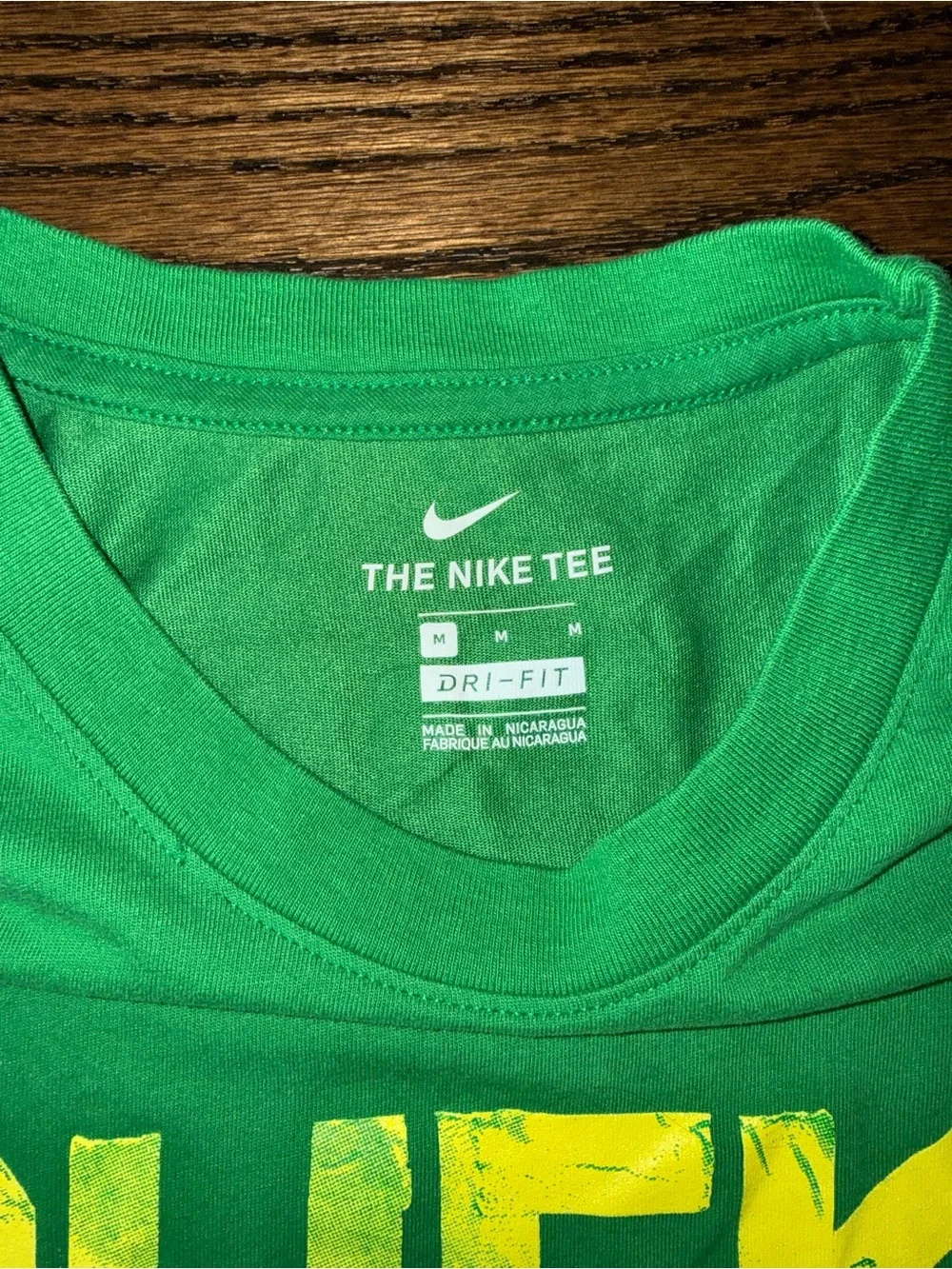 Nike Green Short Sleeve 'Ducks' Graphic Tee with Yellow Accents